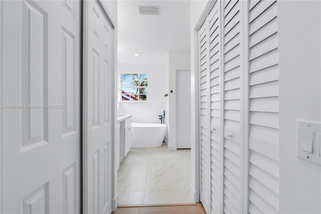 1204 Bayview Cir, Weston, FL 33326 - corridor featuring light marble finish floors and recessed lighting