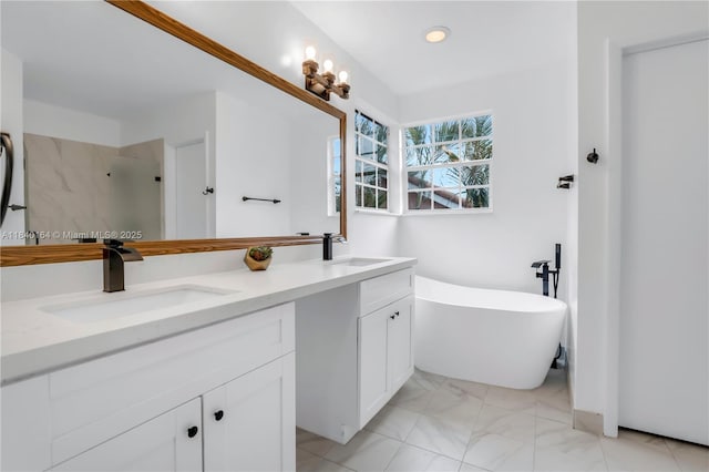 1204 Bayview Cir, Weston, FL 33326 - full bathroom featuring double vanity, a freestanding tub, a shower, marble look tile flooring, and recessed lighting