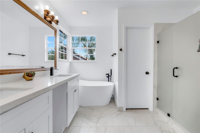 1204 Bayview Cir, Weston, FL 33326 - bathroom with a freestanding bath, marble look tiles, double vanity, and recessed lighting