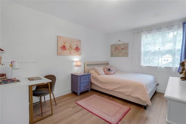 1204 Bayview Cir, Weston, FL 33326 - bedroom with baseboards and light wood-style flooring