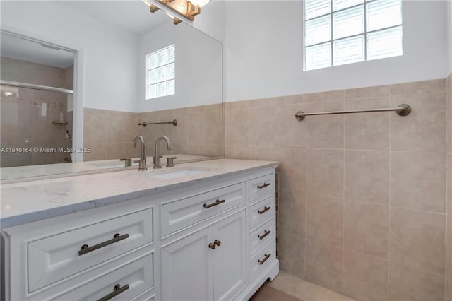 1204 Bayview Cir, Weston, FL 33326 - full bath featuring plenty of natural light, tile walls, vanity, a tile shower, and a wainscoted wall
