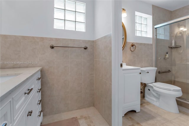 1204 Bayview Cir, Weston, FL 33326 - full bathroom with tile walls, vanity, healthy amount of natural light, a tile shower, and wainscoting