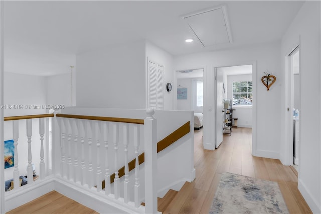 1204 Bayview Cir, Weston, FL 33326 - hall with an upstairs landing, attic access, light wood-style flooring, and recessed lighting
