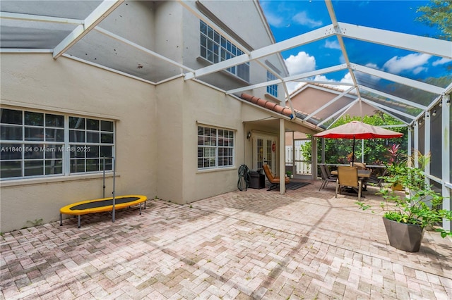 1204 Bayview Cir, Weston, FL 33326 - view of patio / terrace featuring glass enclosure, french doors, and outdoor dining space