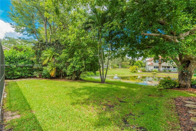 1204 Bayview Cir, Weston, FL 33326 - view of grassy yard featuring a water view