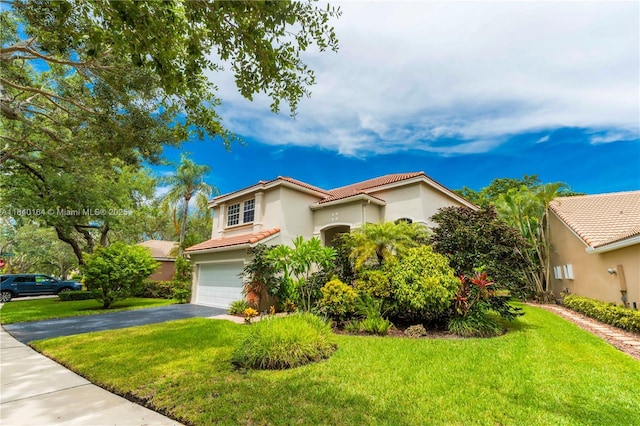 1204 Bayview Cir, Weston, FL 33326 - mediterranean / spanish-style home featuring a garage, a tiled roof, driveway, and a front lawn