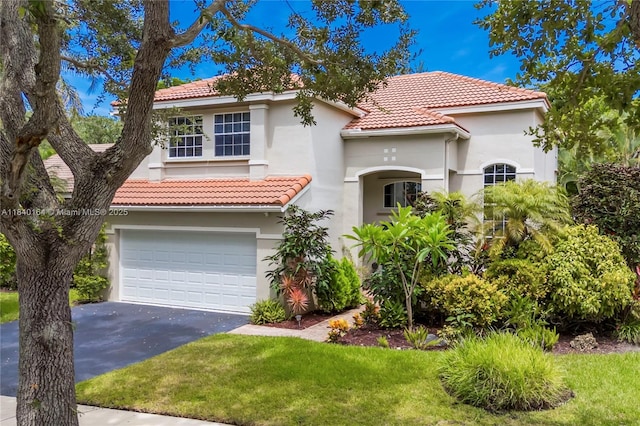 1204 Bayview Cir, Weston, FL 33326 - mediterranean / spanish-style house with stucco siding, a tile roof, driveway, and an attached garage