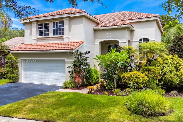 1204 Bayview Cir, Weston, FL 33326 - mediterranean / spanish-style house with stucco siding, asphalt driveway, an attached garage, and a tile roof