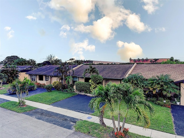 9530 W Daffodil Ln, Miramar, FL 33025 - view of front of property with driveway and a front yard