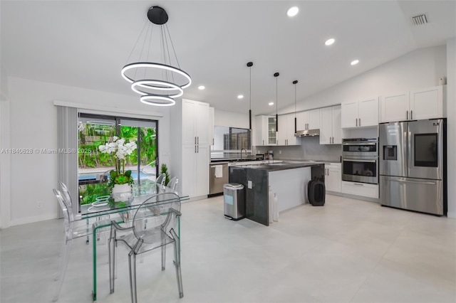 13526 Jonquil Pl, Wellington, FL 33414 - kitchen featuring stainless steel appliances, white cabinetry, a kitchen island, a chandelier, and decorative light fixtures