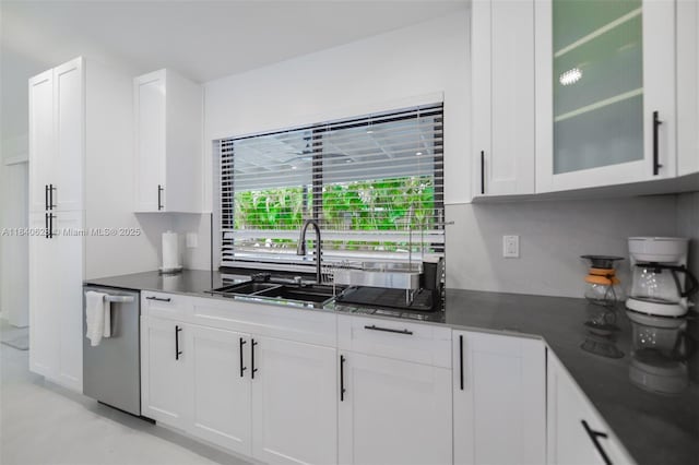 13526 Jonquil Pl, Wellington, FL 33414 - kitchen featuring white cabinets, dark countertops, and stainless steel dishwasher