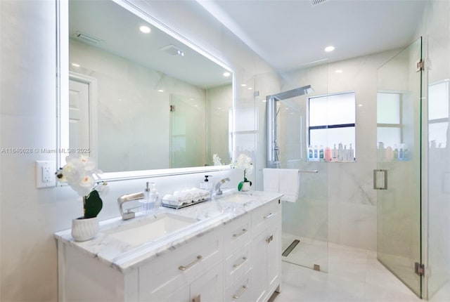 13526 Jonquil Pl, Wellington, FL 33414 - bathroom featuring double vanity, a shower stall, and recessed lighting