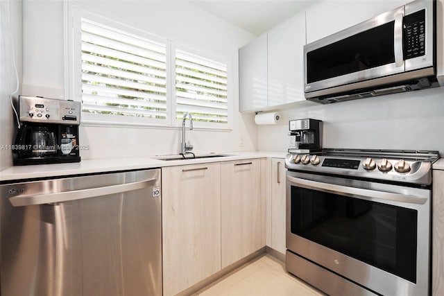 2511 Tequesta Ln, Coconut Grove, FL 33133 - kitchen with stainless steel appliances, light countertops, and modern cabinets