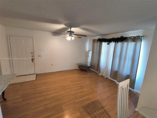 10361 SW 150th Ct Unit 13104, Miami, FL 33196 - unfurnished room featuring light wood-style floors, a ceiling fan, and a textured ceiling