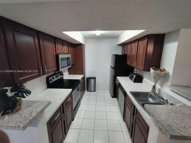10361 SW 150th Ct Unit 13104, Miami, FL 33196 - kitchen with appliances with stainless steel finishes, light tile patterned flooring, and light countertops