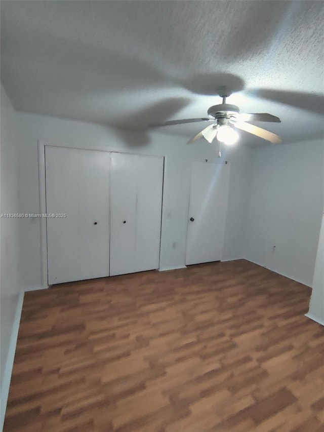 10361 SW 150th Ct Unit 13104, Miami, FL 33196 - unfurnished bedroom with wood finished floors, a textured ceiling, and ceiling fan