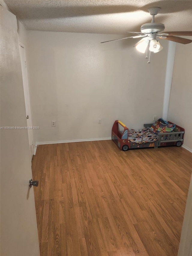 10361 SW 150th Ct Unit 13104, Miami, FL 33196 - unfurnished room featuring wood finished floors, ceiling fan, and a textured ceiling