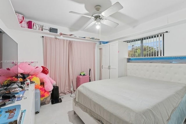 11610 NE 6th Ave, Biscayne Park, FL 33161 - bedroom with light tile patterned floors and ceiling fan