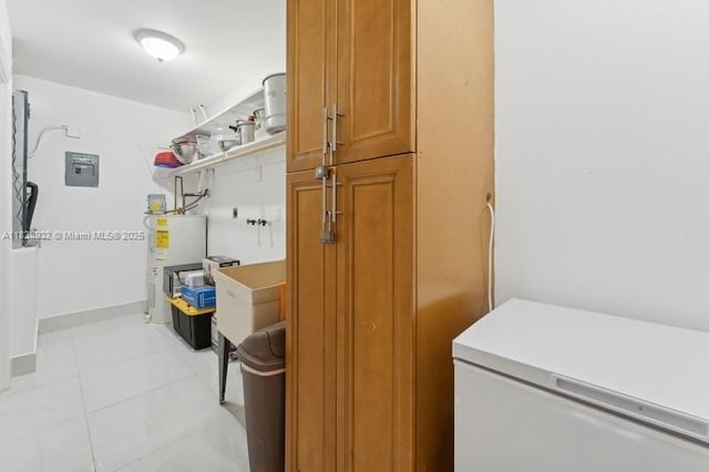 11610 NE 6th Ave, Biscayne Park, FL 33161 - washroom with water heater and light tile patterned floors