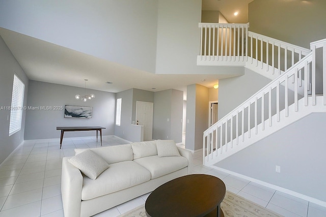 14972 SW 50th Ct, Davie, FL 33331 - living area with tile patterned floors, stairway, and a towering ceiling