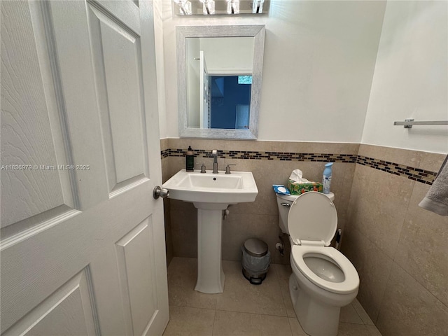 14972 SW 50th Ct, Davie, FL 33331 - bathroom featuring tile patterned floors, tile walls, and wainscoting