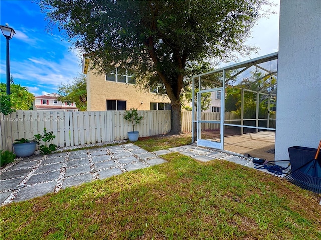 14972 SW 50th Ct, Davie, FL 33331 - fenced backyard featuring a patio area and glass enclosure