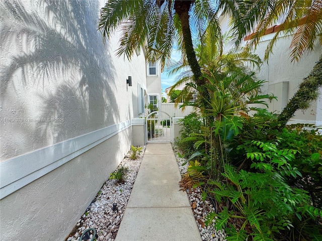 14972 SW 50th Ct, Davie, FL 33331 - view of property exterior featuring a gate and stucco siding