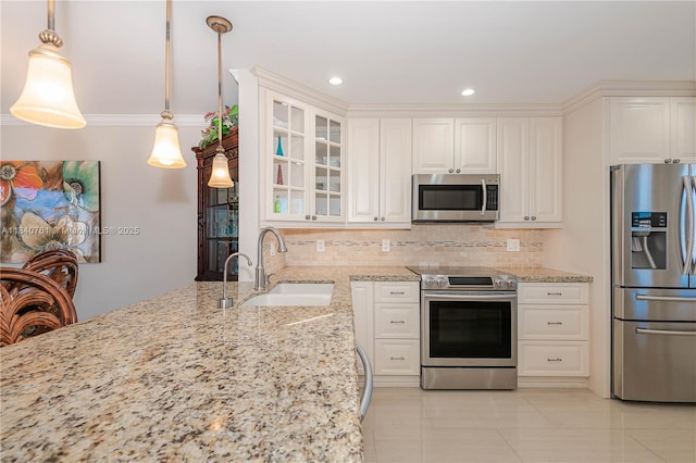 200 NE 14th Ave Unit 524, Hallandale Beach, FL 33009 - kitchen with appliances with stainless steel finishes, tasteful backsplash, light stone countertops, glass insert cabinets, and white cabinets