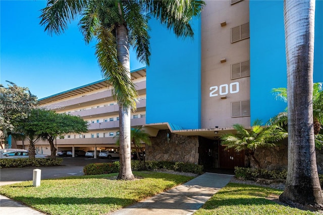 200 NE 14th Ave Unit 524, Hallandale Beach, FL 33009 - view of building exterior featuring covered parking