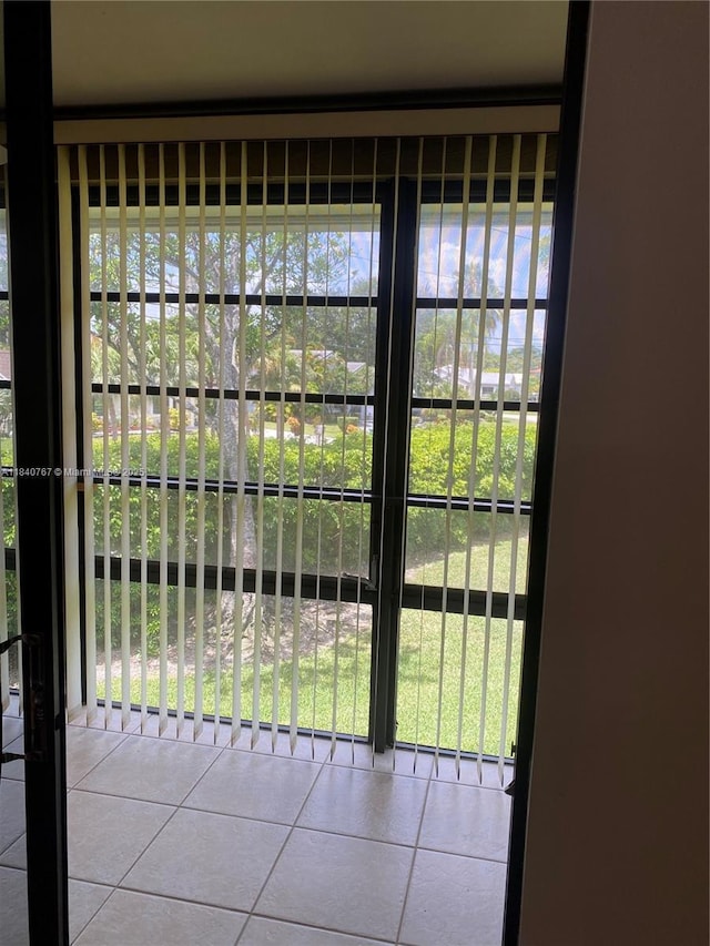 10407 E Clairmont Cir Unit 210, Tamarac, FL 33321 - doorway with tile patterned floors and healthy amount of natural light