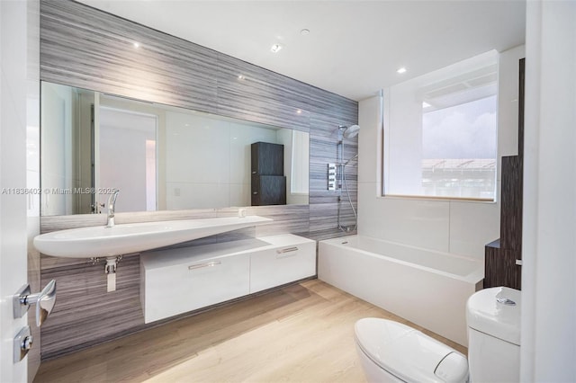 5959 Collins Ave Unit 705, Miami Beach, FL 33140 - full bathroom featuring wood finished floors, bathing tub / shower combination, and tile walls