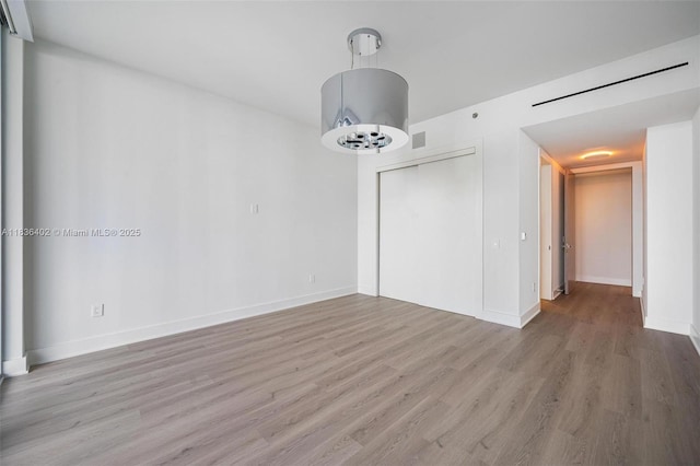 5959 Collins Ave Unit 705, Miami Beach, FL 33140 - spare room with light wood-style flooring and baseboards