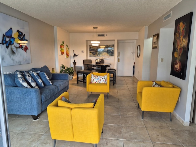 4001 Hillcrest Dr Unit 705, Hollywood, FL 33021 - tiled living room with a textured ceiling