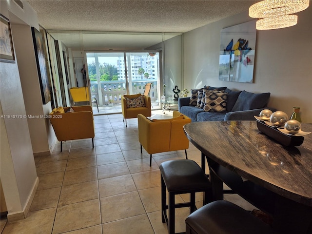 4001 Hillcrest Dr Unit 705, Hollywood, FL 33021 - living area with a textured ceiling, a chandelier, and light tile patterned flooring
