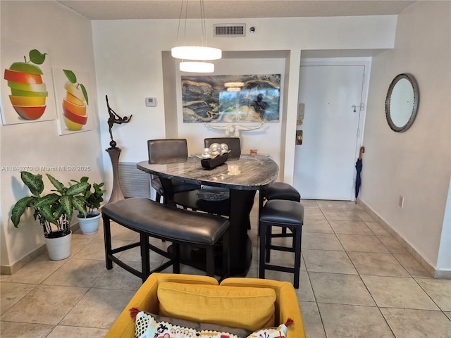 4001 Hillcrest Dr Unit 705, Hollywood, FL 33021 - dining area with light tile patterned flooring and baseboards
