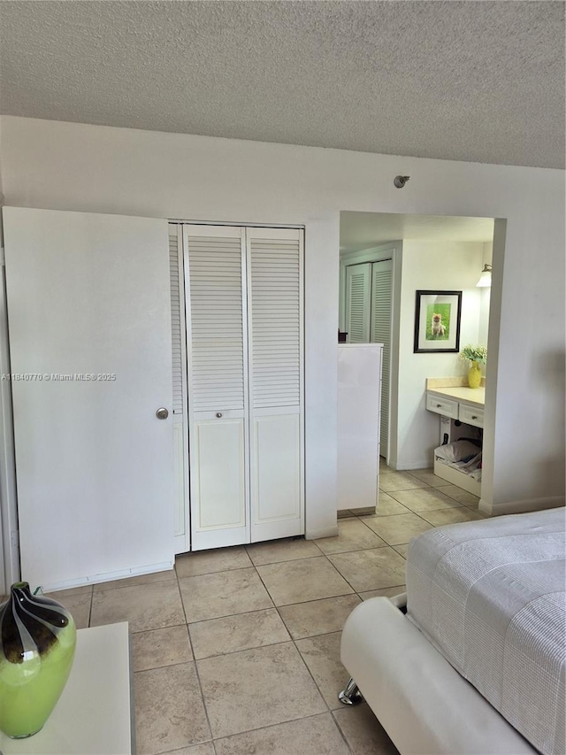 4001 Hillcrest Dr Unit 705, Hollywood, FL 33021 - bedroom with light tile patterned floors and a textured ceiling