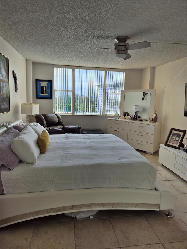 4001 Hillcrest Dr Unit 705, Hollywood, FL 33021 - bedroom with light tile patterned floors, a textured ceiling, and ceiling fan