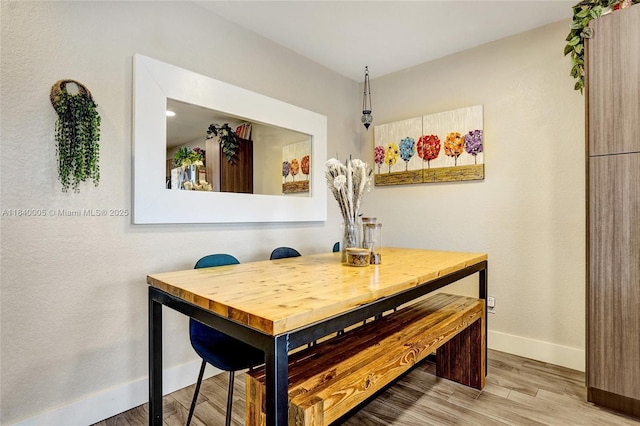 8657 SW 22nd Ct, Miramar, FL 33025 - dining area featuring baseboards and light wood-style floors