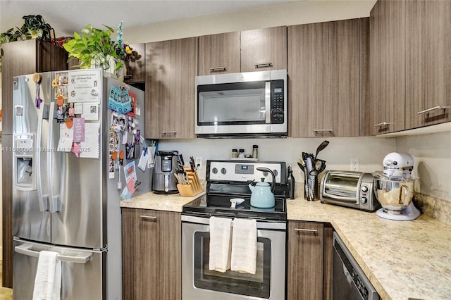 8657 SW 22nd Ct, Miramar, FL 33025 - kitchen with appliances with stainless steel finishes and light countertops