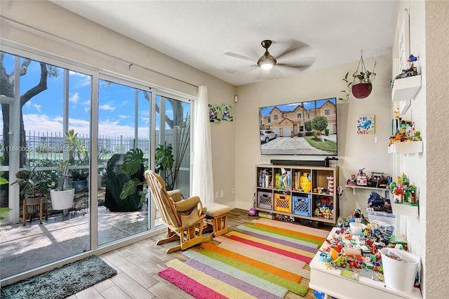 8657 SW 22nd Ct, Miramar, FL 33025 - rec room with a ceiling fan and wood finished floors