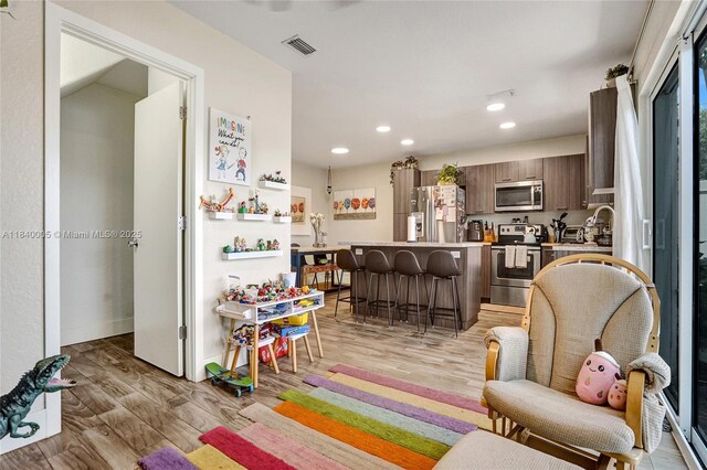 8657 SW 22nd Ct, Miramar, FL 33025 - living area with light wood-style floors and recessed lighting
