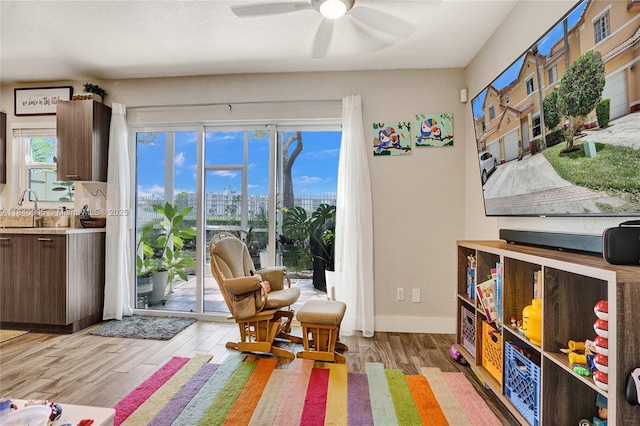8657 SW 22nd Ct, Miramar, FL 33025 - sitting room featuring light wood finished floors and ceiling fan