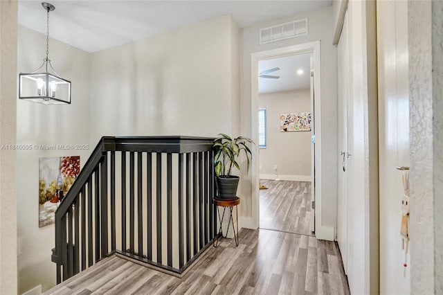 8657 SW 22nd Ct, Miramar, FL 33025 - hall with wood finished floors and a chandelier