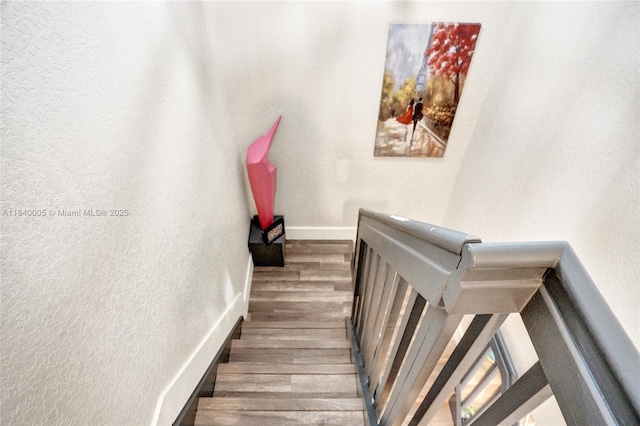 8657 SW 22nd Ct, Miramar, FL 33025 - staircase featuring wood finished floors and a textured wall