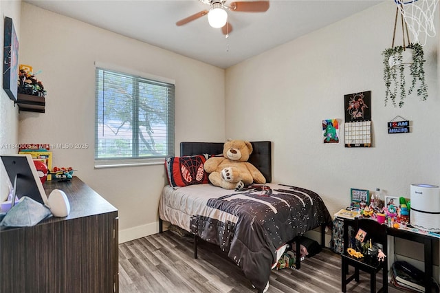 8657 SW 22nd Ct, Miramar, FL 33025 - bedroom with wood finished floors, ceiling fan, and a baseboard heating unit