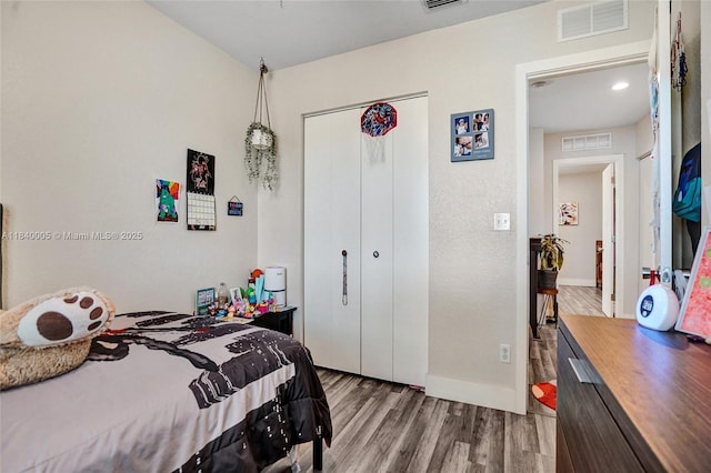 8657 SW 22nd Ct, Miramar, FL 33025 - bedroom with wood finished floors, a closet, and recessed lighting