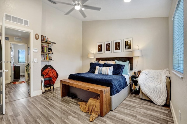 8657 SW 22nd Ct, Miramar, FL 33025 - bedroom with light wood finished floors, multiple windows, vaulted ceiling, and a ceiling fan
