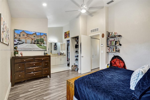 8657 SW 22nd Ct, Miramar, FL 33025 - bedroom with wood finished floors, a high ceiling, ensuite bath, and ceiling fan