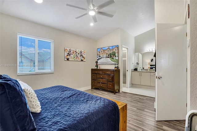 8657 SW 22nd Ct, Miramar, FL 33025 - bedroom with light wood-type flooring, vaulted ceiling, ensuite bathroom, ceiling fan, and recessed lighting