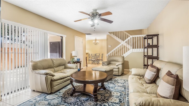 135 Heritage Way, West Palm Beach, FL 33407 - living area with stairs, light tile patterned floors, a ceiling fan, a chandelier, and a textured ceiling